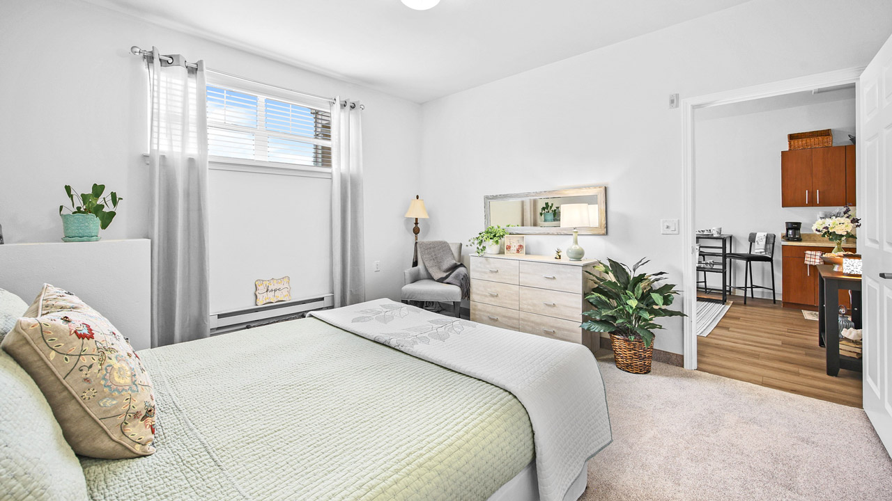 A furnished bedroom in a Liberty Heights apartment